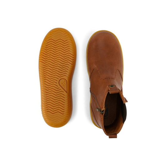 The Bobux Kid+ Jodhpur Leather Boot Toffee 830010E is shown from above and below; the left boot reveals a textured tan rubber sole, while the right displays the smooth leather upper with a side zipper., 9420068521414, 9420068521421, 9420068521438, 9420075
