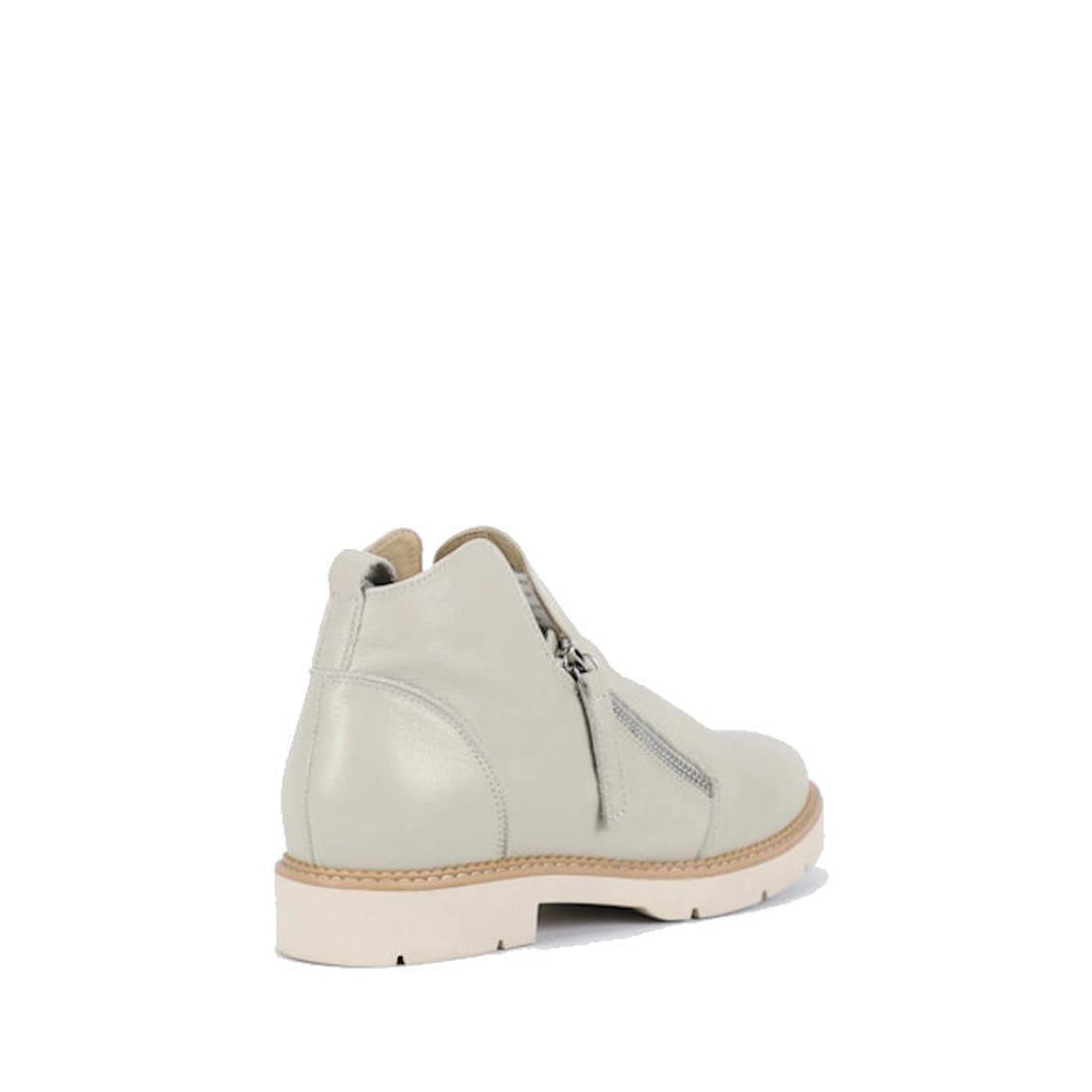 The Bay Lane Clara Ice Light Grey Women's Leather Low Cut Ankle Zip Boot features premium leather, a beige sole, side zipper, and luxe support footbed for all-day comfort. Shown angled to highlight the outer side and back against a white background., 5127