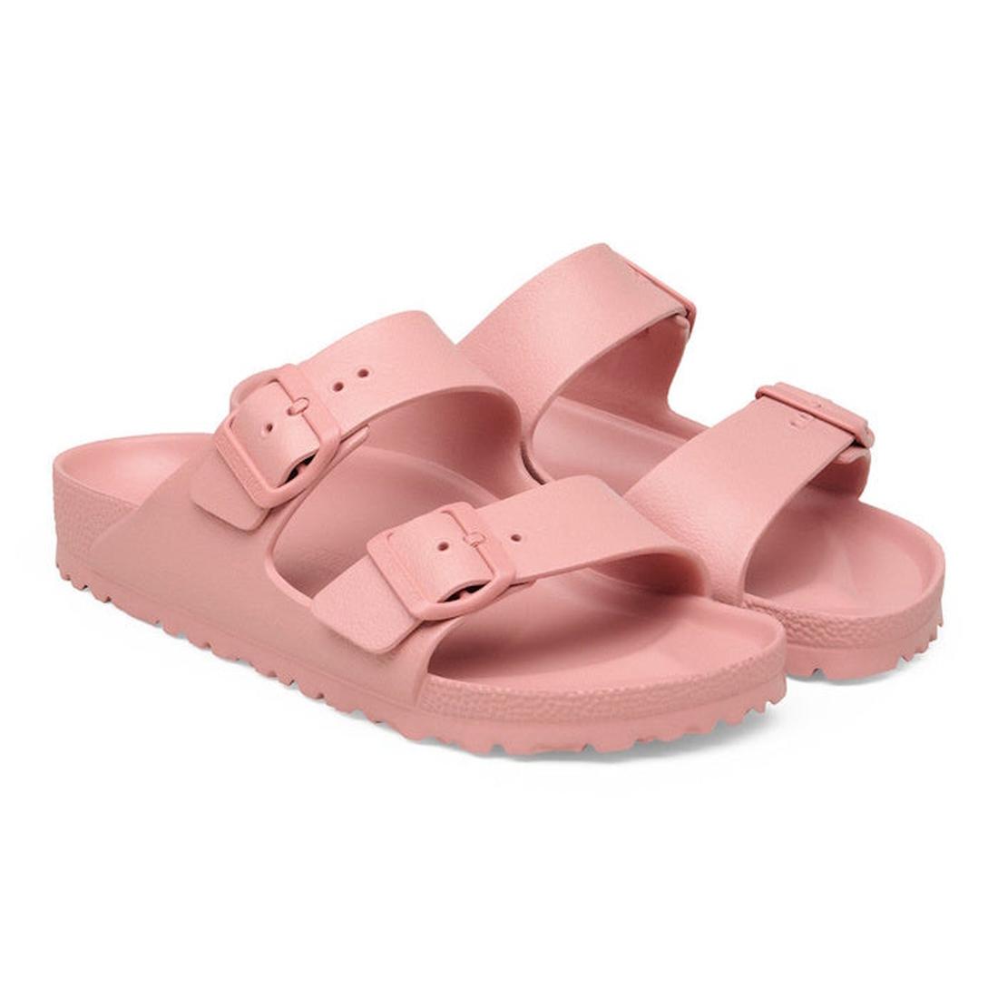 The BIRKENSTOCK Arizona EVA Pink Clay Narrow Width sandals feature two adjustable buckle straps and textured soles, with an anatomically shaped footbed, displayed at a slight angle on a white background., 52535, 4067707638901, 4067707638949, 4067707638987
