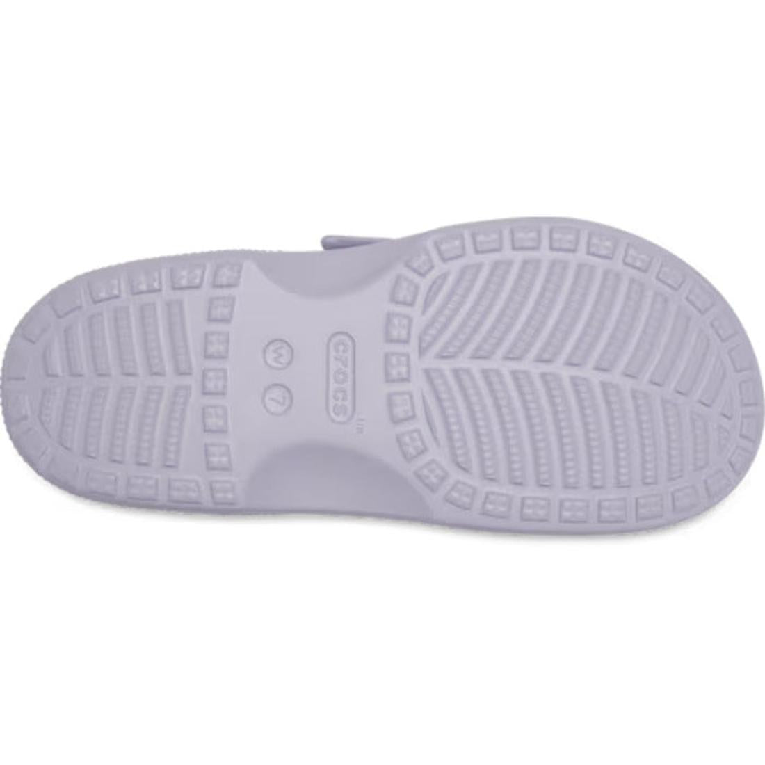 A close-up view of the light purple sole of a Crocs shoe, highlighting the textured tread pattern and central Crocs logo—a perfect example of Crocs Comfort found in styles like the Crocs Womens Saturday Enamel Buckle Purple Halo Sandal Slide, which featur