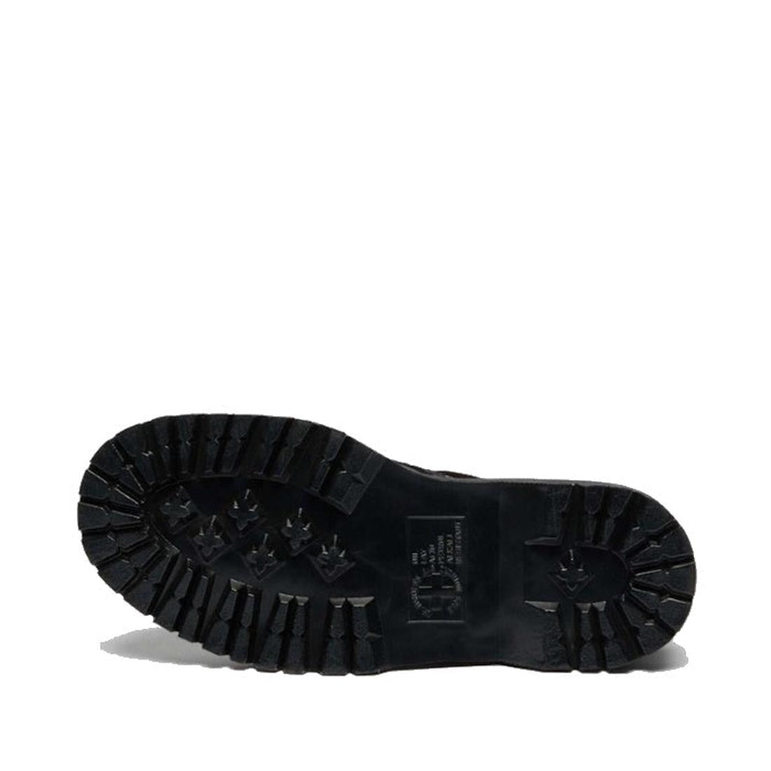 A Dr Martens 1460 Bex Black Buckle Atlas Leather Boot With Zip is lying on its side, offering a close-up view of the rugged, patterned-tread sole against a white background. Crafted from Atlas leather with Goodyear-welted construction and finished with si