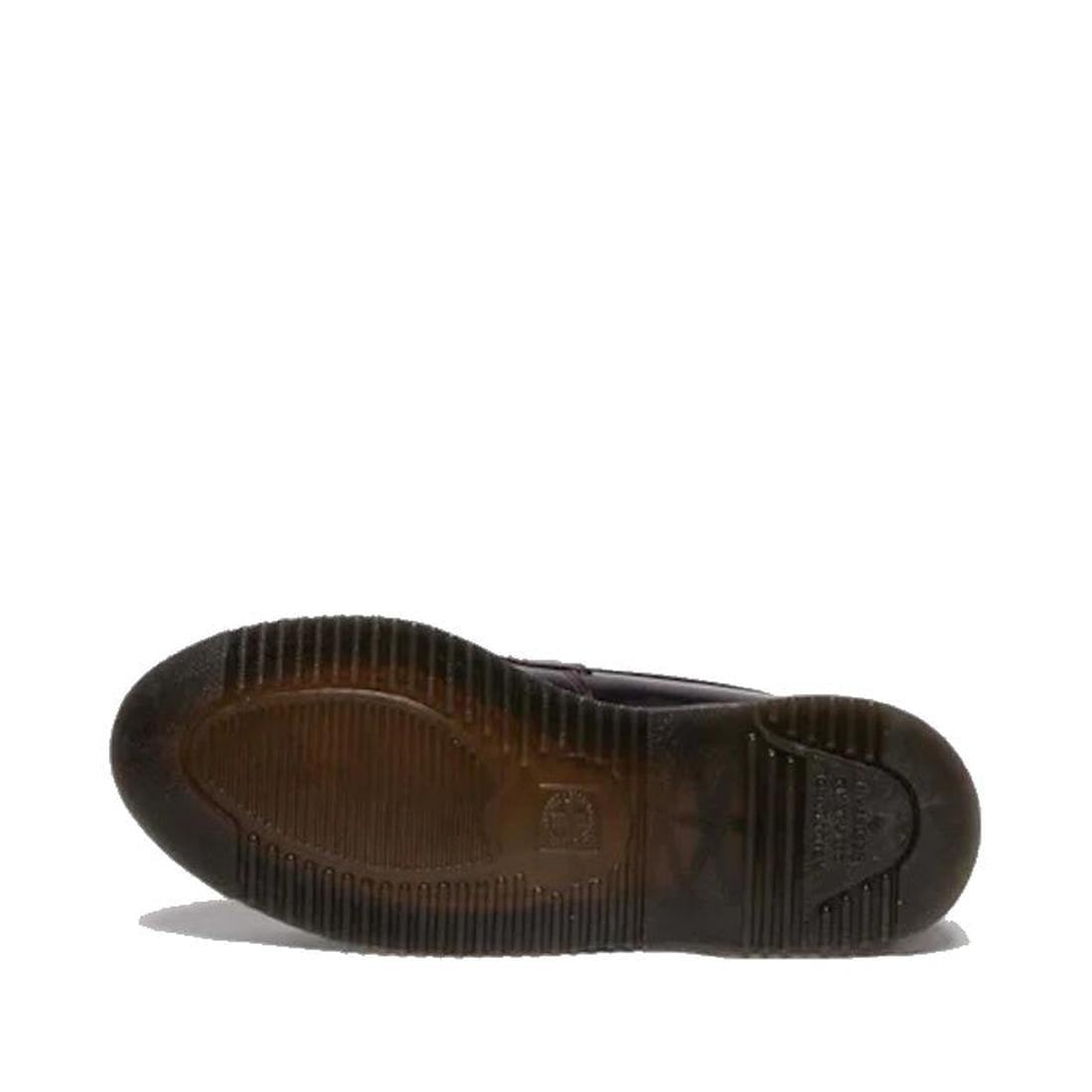 A single Dr Martens Temara Cherry Red Arcadia Leather Loafer is shown from the bottom, highlighting its textured, ridged rubber sole with a rectangular logo and worn areas against a plain white background., 190665747560, 190665747577, 190665747591, 52060,