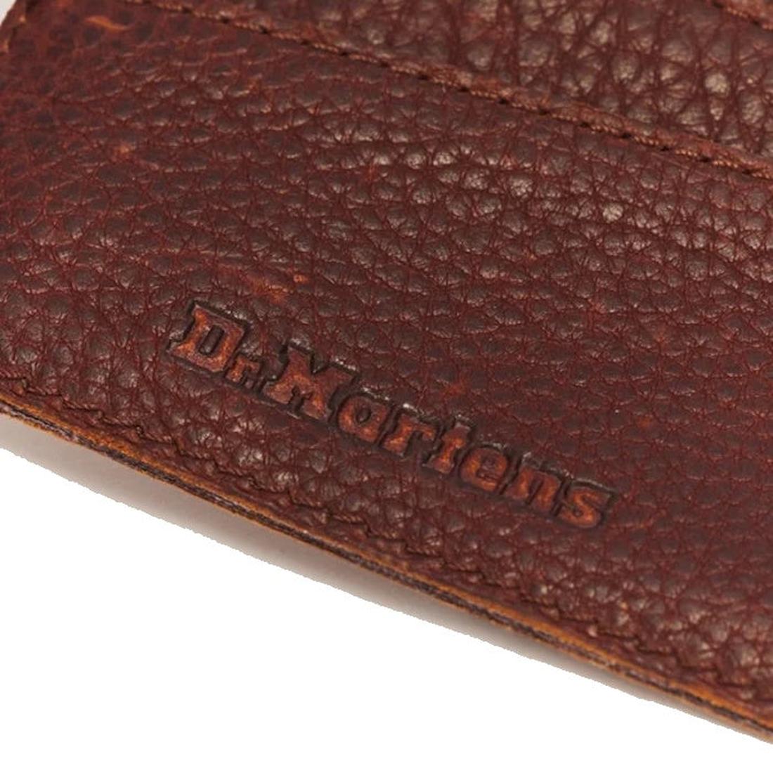 Close-up of cashew-colored, textured Ambassador leather on the Dr. Martens Cardholder II Wallet, featuring an embossed Dr. Martens logo, fine edge stitching, and multiple card slots at the top—perfect for a minimalist cardholder style., 190665763973