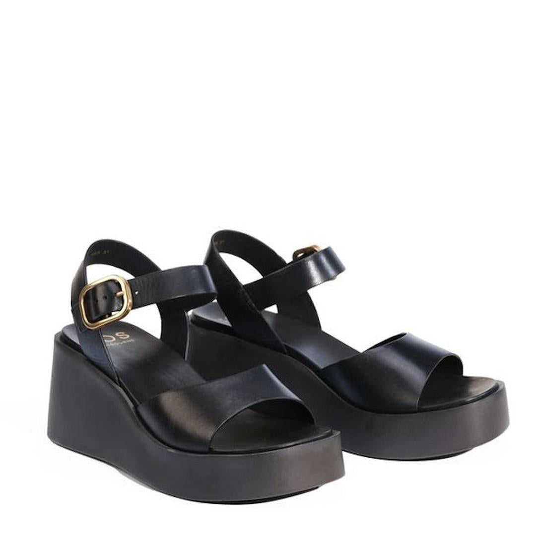 The EOS Ariya Black Leather Dressy Wedge Platform Sandal features an anatomical footbed, thick soles, wide crisscross straps with gold buckles, and an ankle strap, shown on a white background., 47956, 9321191293714, 9321191293721, 9321191293738, 932119129
