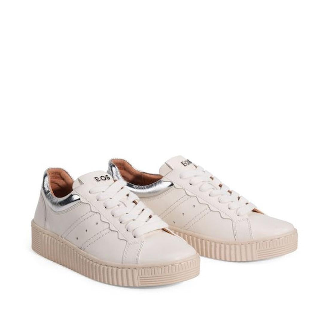 The EOS Jolie Bone Beige Womens Leather Trainer With Zip features white leather, beige soles, side perforations, metallic silver heel detail, and visible branding on the tongue—combining comfort, style, and versatility in one chic sneaker., 47242, 9321191