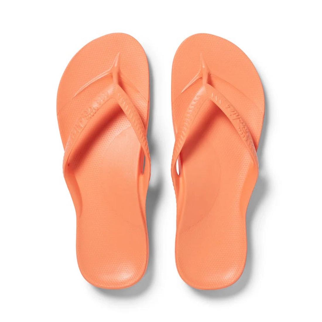 Archies Arch Support Jandal Peach sandals, comfy textured sole and easy slip-on style, perfect for family summer fun on a white background. ksnz
