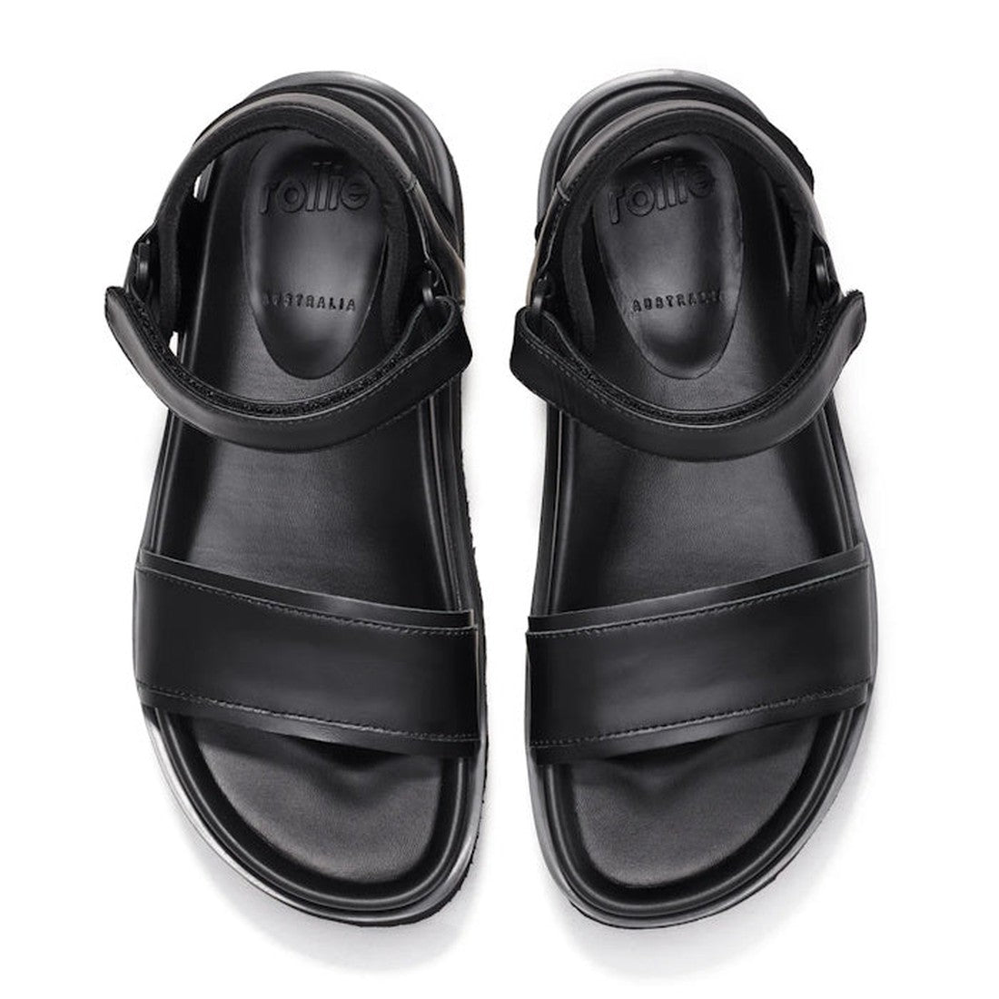 The Rollie Womens Ace Sandal All Black Leather is a lightweight platform sandal with thick straps and ankle support, shown side by side on a white background. Comfortable insoles are embossed with "rollie" and "AUSTRALIA., 9339554333878, 9339554333885, 93