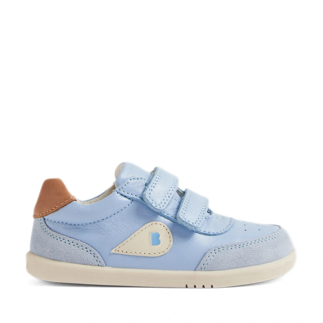 The Bobux IW Iwalk Toddlers Champ Leather Sneaker in Skyway Blue features a light blue design with two hook-and-loop straps, beige and brown accents, and a white sole. A small B logo adorns the side, while suede detailing near the toe and heel adds style