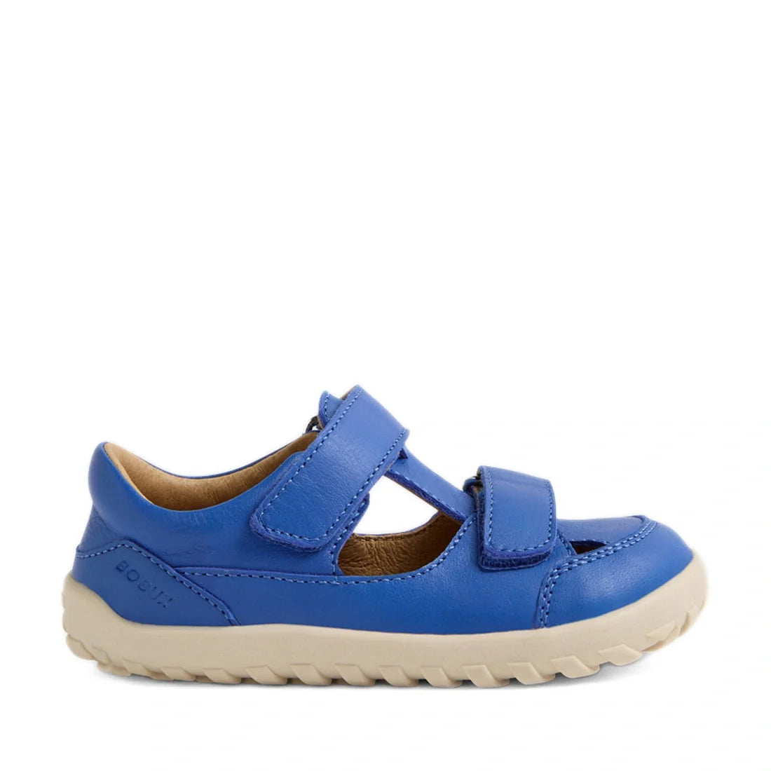 The Bobux IW Iwalk Troop Toddlers Leather Sandal in Dazzling Blue features two Velcro straps, a tan interior lining, and a durable white rubber sole. Designed with a closed toe and rugged, grippy outsole for active play, this barefoot-style children’s san