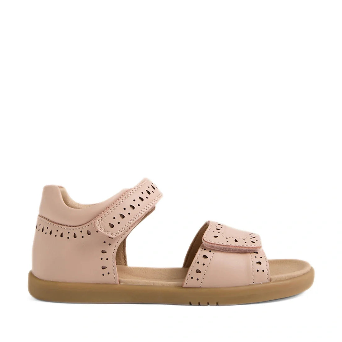 A single Bobux Kid+ Plus KP Logan Cameo Rose Pink Open Toe Sandal featuring stylish cut-out patterns, an open toe, adjustable Velcro toe and ankle straps, and a comfortable flat rubber sole—ideal for little feet looking for both comfort and classic leathe