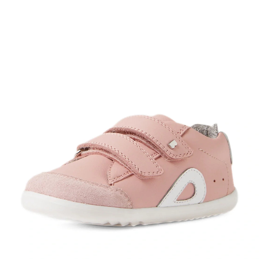 The Bobux SU Step Up Blaze Leather Toddlers Sneaker in Ballet Pink features two Velcro straps, white accents, a gray fabric lining, and a white rubber sole. Shown on a white background, these adorable sneakers are perfect as first walking shoes or for lit