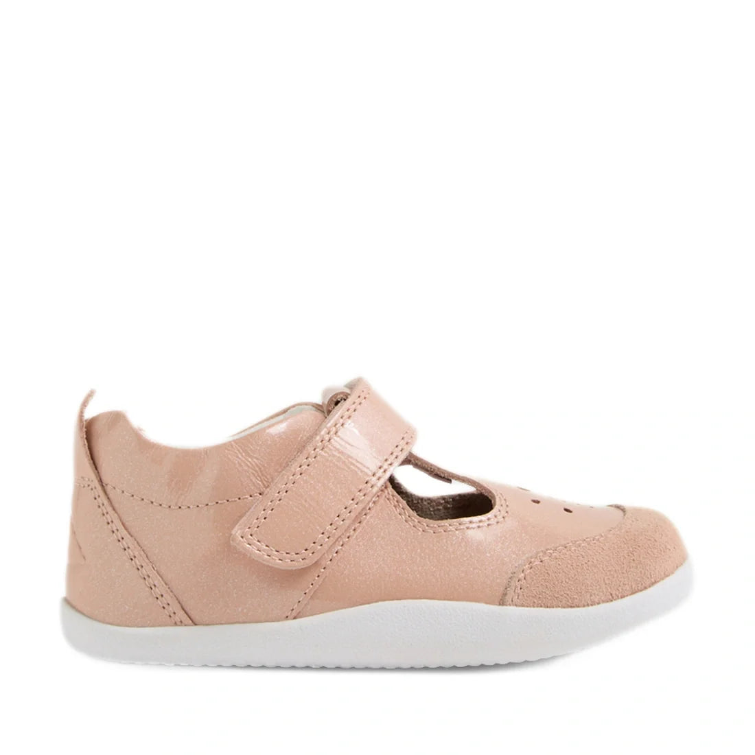 Introducing the Bobux XP Explorer Rue First Walker Sandal Patent Camo Rose Pink: a light pink children’s shoe featuring a Velcro strap, closed toe, stylish cut-out details on top, and a flexible sole for added comfort. Displayed on a white background, the