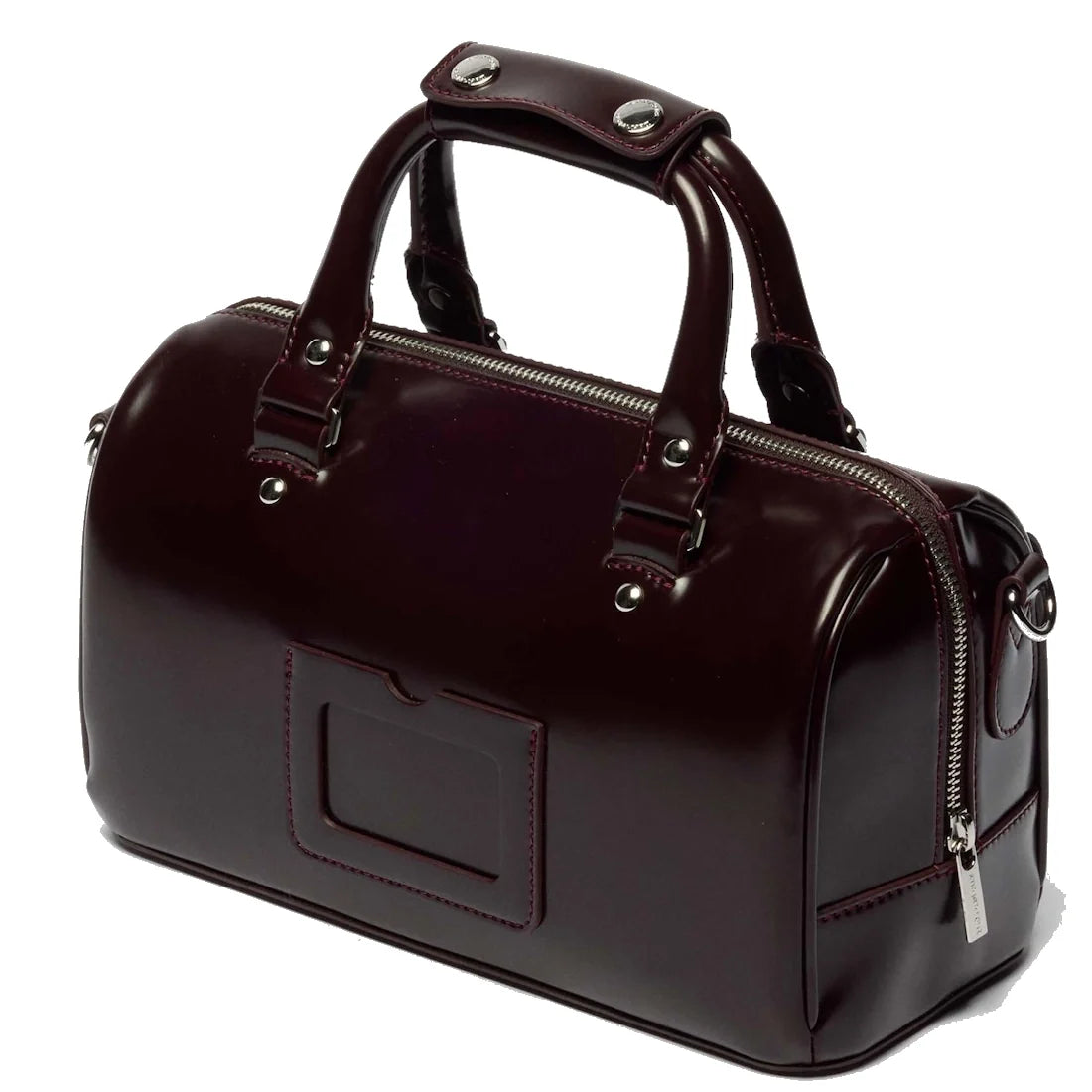 A glossy cherry red leather handbag, the Dr Martens Top Handle Bag in Oxford Rub Off, takes inspiration from classic Dr Martens styling and features two sturdy handles, silver hardware, a front pocket, and a top zip closure.