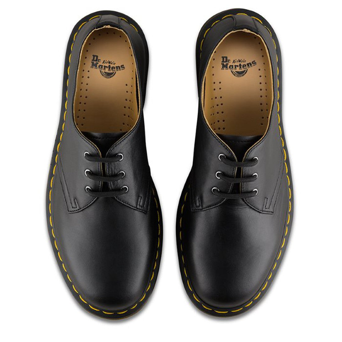 A pair of Dr. Martens 1461 Shoes in black Nappa leather, 3-eye lace-up Oxfords, shown from above with yellow stitching, tan inner lining, and the Dr. Martens logo on the insole., 800090827101, 800090827118, 800090827125, 800090827132, 800090798746, 800090