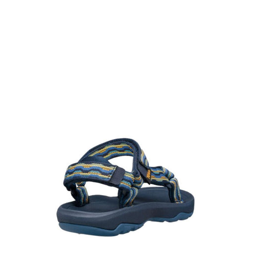 The Teva Kids K Hurricane XLT2 Kishi Dark Blue sandal, featuring a thick sole and adjustable straps, is made from recycled materials and is displayed angled from the back on a white background., 192410699667, 192410699674, 192410699681, 192410699636, 1924