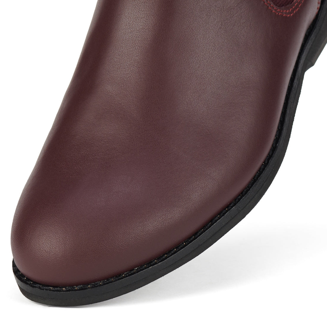 Close-up of the toe and sole of the Rollie Womens Chelsea Dark Cherry Leather Ankle Boot, featuring smooth leather texture, black trim, and detailed stitching that highlight its elegant design and exceptional craftsmanship., 9339554019543, 9339554104898,