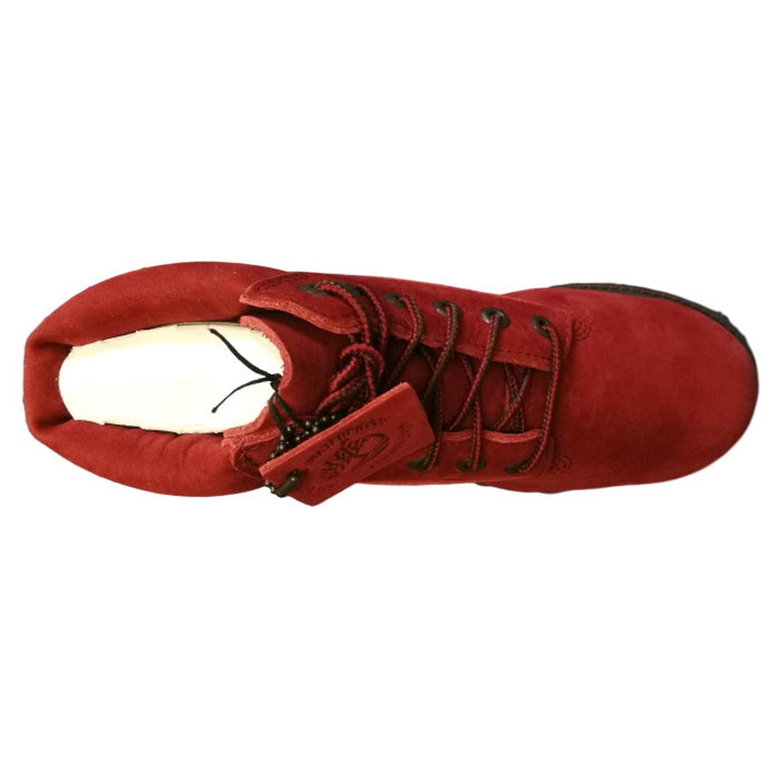 Top view of a single Timberland Kids Dark Red Icon Juniors 6 Inch Premium Waterproof Boot, featuring red suede with black laces and a black sole. The boot has a tag attached to one lace and a light-colored insole visible inside, reminiscent of classic Tim