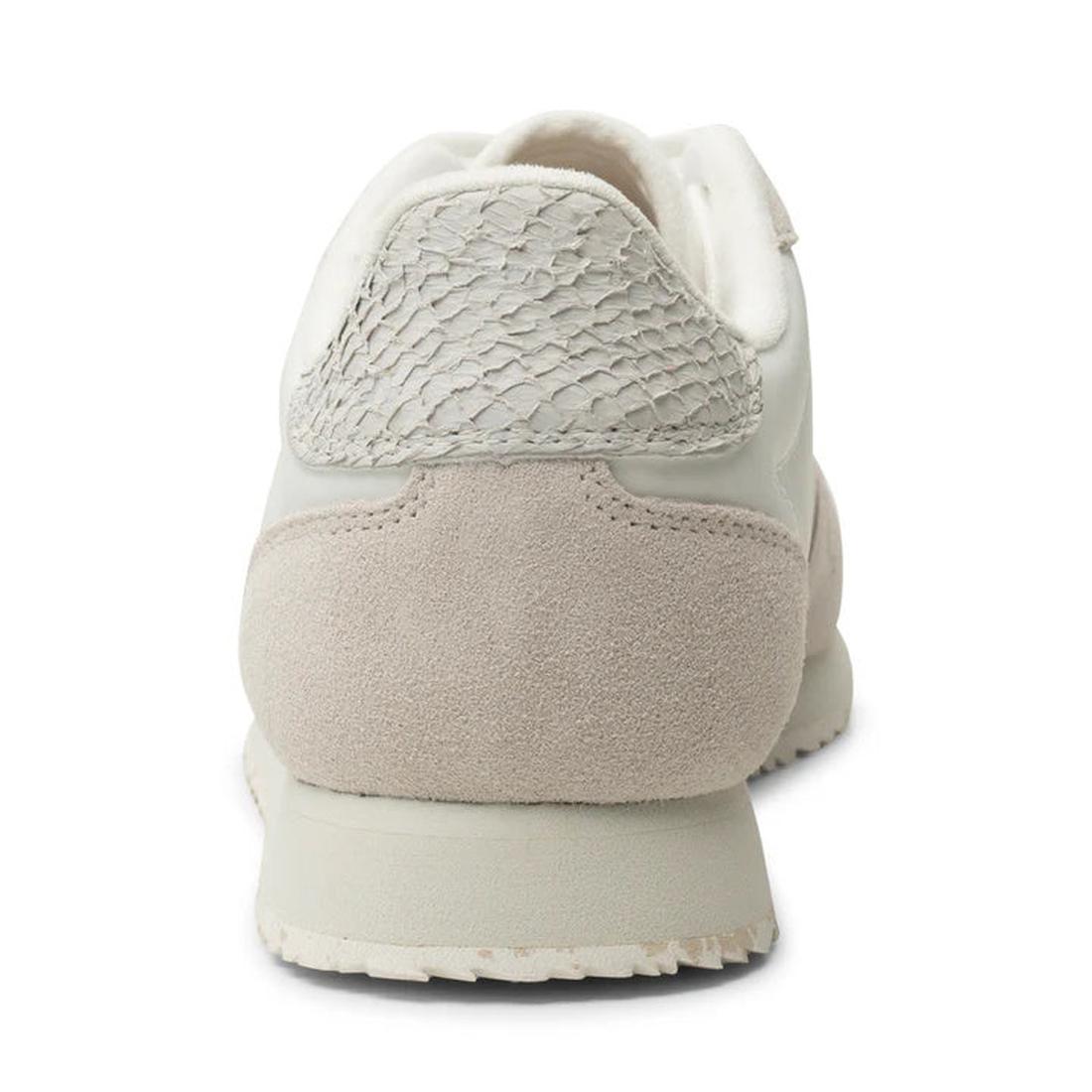 A close-up rear view of the Woden Womens Sneaker Nora III Nylon/Leather Blanc de Blanc highlights its neutral tones and blend of smooth nylon and leather, featuring a suede heel and rubber sole—ideal versatile urban footwear., 5713326428360, 5713326428377