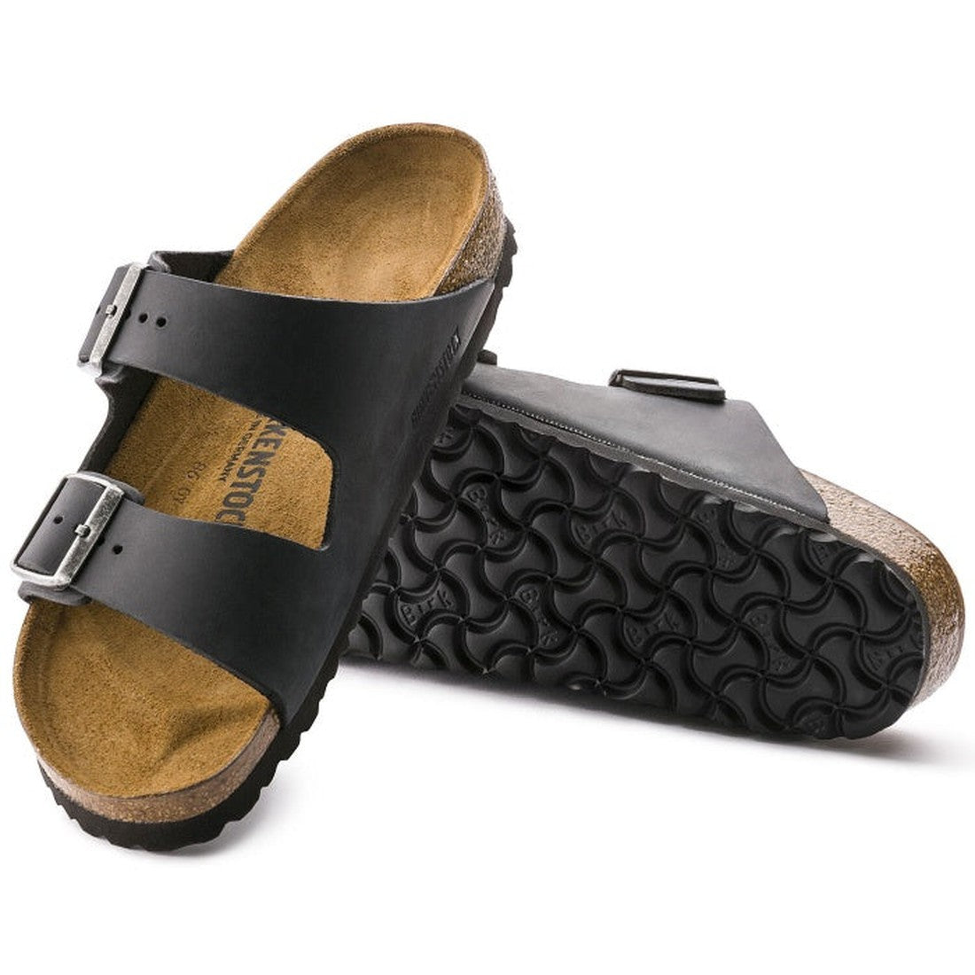 a pair of Birkenstock Arizona Oiled Leather Black Narrow Width with double straps, one over the foot and one over the toes with buckle adjustment. Staps are linked at the sides of the foot. Leather thick straps and a suede leather footbed,