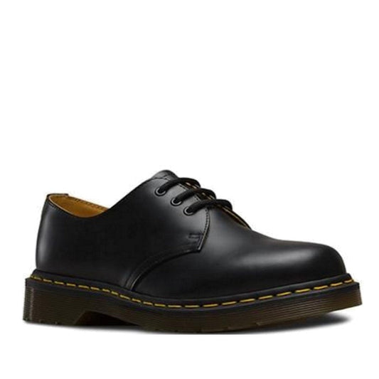 Image of right foot, side on of Dr Martens - 1461 Smooth Leather Shoes Oxford 3 Eye Black showing 3 eyelets and yellow stitching around the sole -Foot Forward Shoes