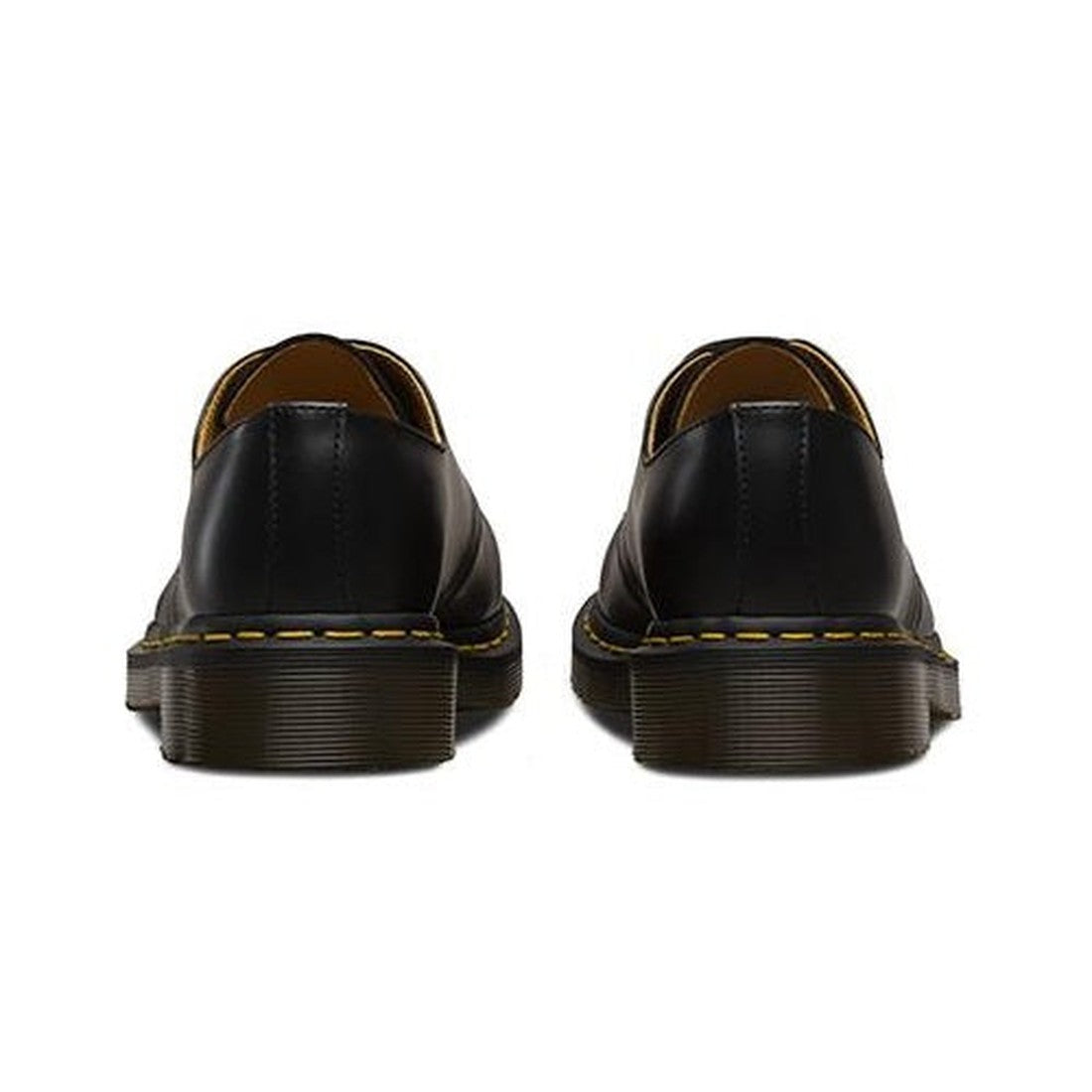 rear heel view of a apair of Dr Martens 1461 in black leather showing stitching detail on heel and yellow stitching around sole.,
800090826883,
800090826906,
800090826920,
800090797534,
800090797558,
800090826975,
800090797565,
800090797572,
800090797596,