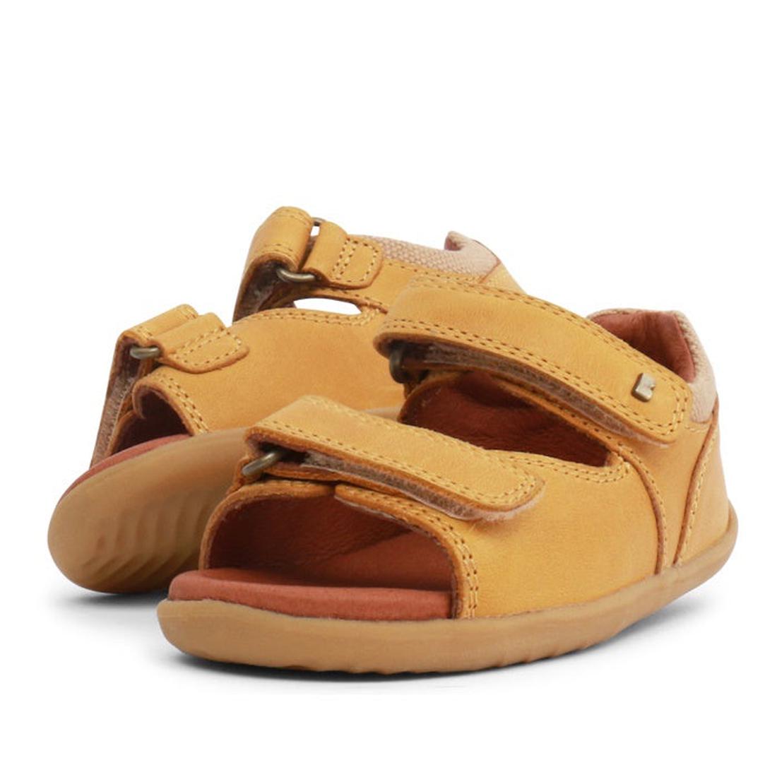The Bobux Step Up SU Driftwood Toddlers Sandal in Chartreuse Yellow (728608) features open toes, velcro straps, and tan soles, shown side by side against a white background.