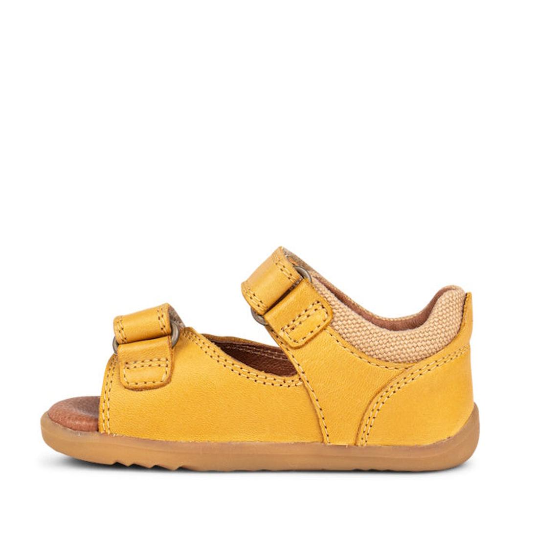 The Bobux Step Up SU Driftwood Toddlers Sandal in Chartreuse Yellow (728608) features premium leather, two adjustable Velcro straps, a brown rubber sole, and an open toe—ideal for first walkers. Shown in side profile on a white background., 9420062001387,