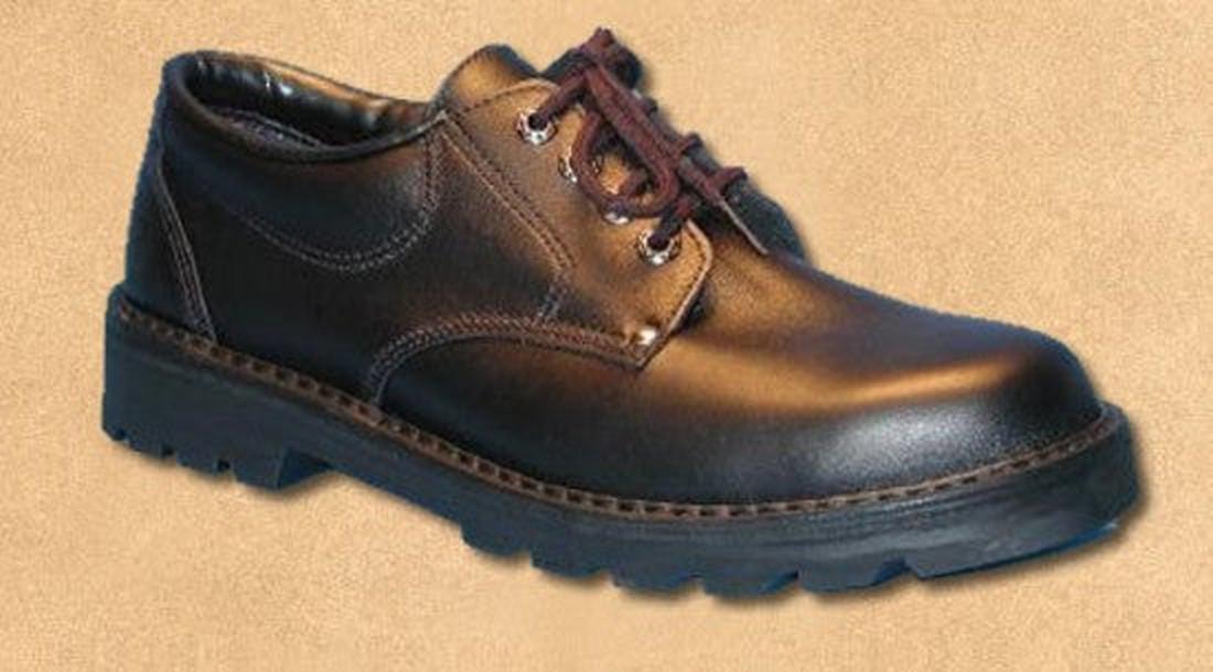 The McKinlays Delta Senior School Shoe for big kids is crafted from NZ-made black leather, features brown laces and a thick rugged sole, and is displayed against a tan background., 3001, 3003, 2858, 2859, 2860, 2861, 2862, 3287, 2864, 2865, 2866, 2887, 28