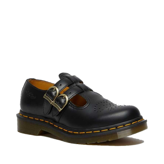 The Dr Martens 8065 2 Strap Mary Jane Shoe Black Smooth features smooth black leather, two buckle straps, decorative toe perforations, and a chunky sole with signature yellow stitching.