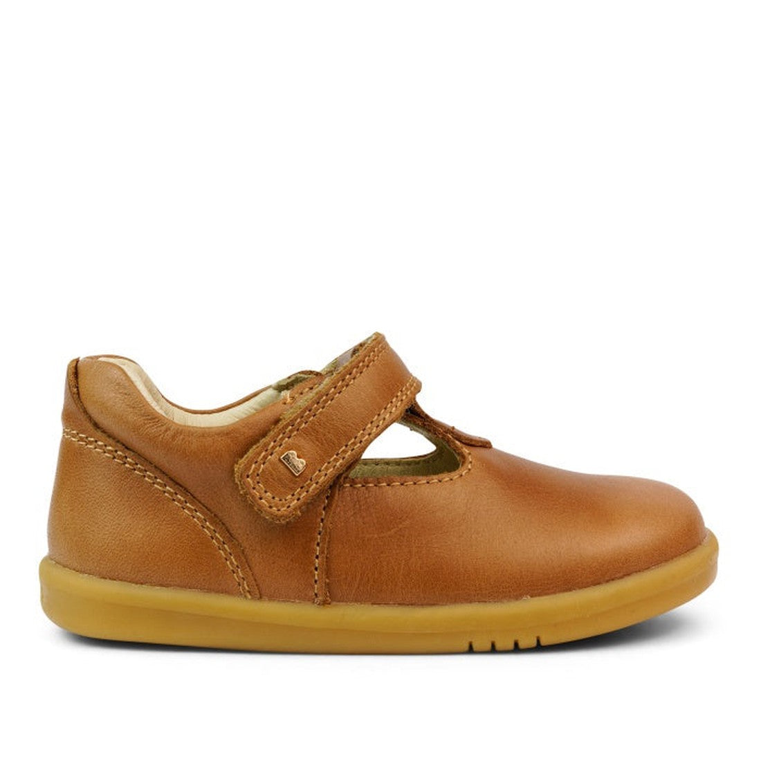 The Bobux Iwalk IW Louise T-Bar Caramel Tan is a single children’s shoe in vintage brown leather with a T-bar design, adjustable strap, rounded toe, and light brown rubber sole, shown in profile facing right., 9420062092170, 9420062092187, 9420062092194, 