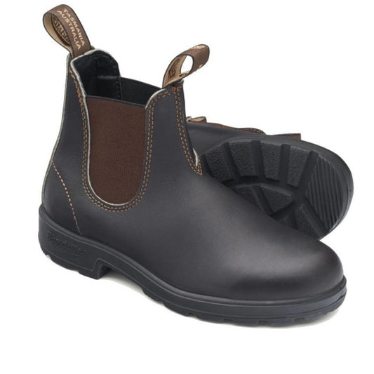 A pair of blundstone 500 dark brown leather pull on booots. showing the outside of the right foot and sole of the left foot. shows eleatic gusset on both sides of the leg.