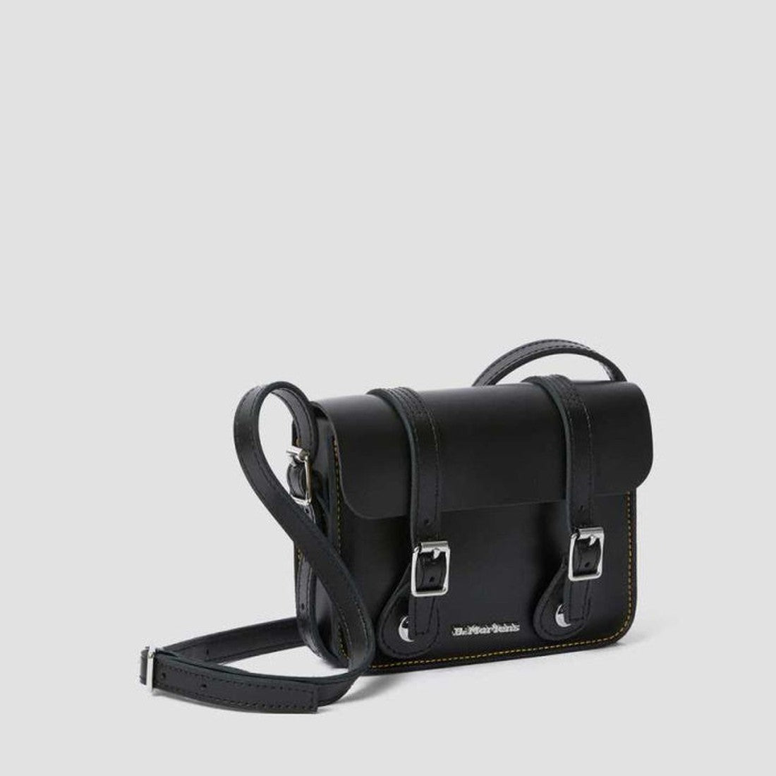 Dr Martens Leather Cross Body Satchel in black—a sturdy kids' bag with comfy strap, strong sole, buckle closure & neat stitching.  ksnz, 190665191974