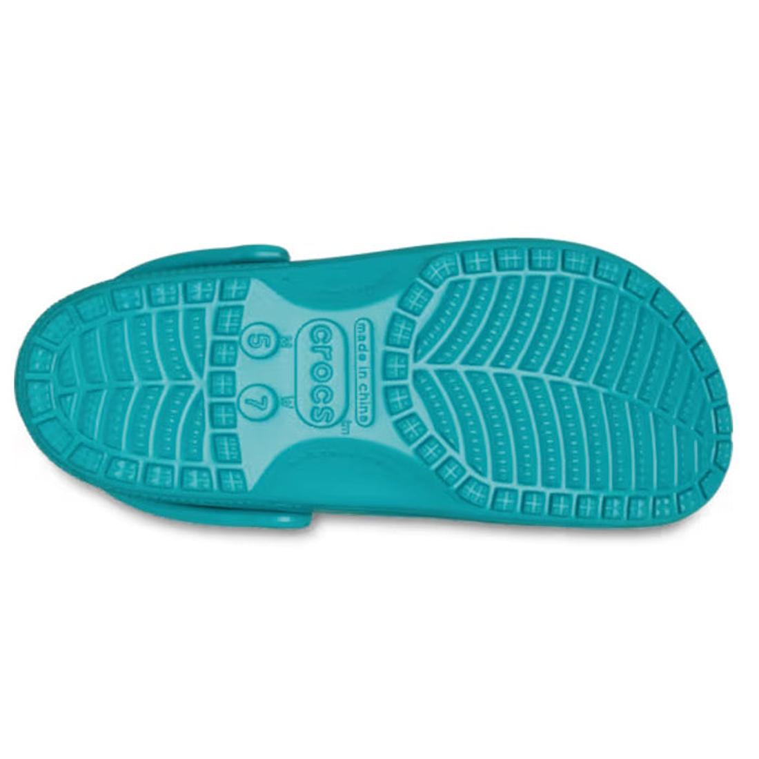 The image shows the sole of Crocs Kids - Classic Clog Green Turbo Teal - Junior Youths Sizes, with a textured leaf-like tread, Crocs logo, sizes 6 and 7 marked, and water-friendly features ideal for kids., 198445260889, 198445260896, 198445260902, 1984452