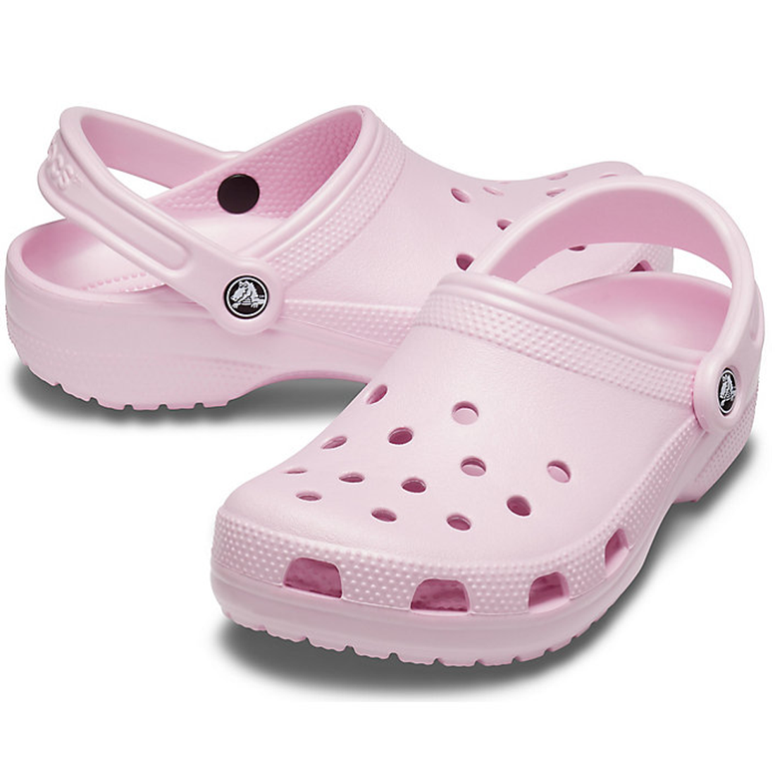 The Crocs - Classic Clog Ballerina Light Pink Adults features ventilation holes and adjustable heel straps in a unisex style, shown on a white background.
