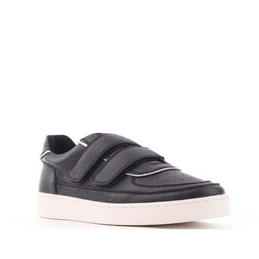 Alfie & Evie Apple Black Leather Women’s Sneaker with comfy white sole and easy hook-and-loop straps, angled on a plain backdrop.  ksnz