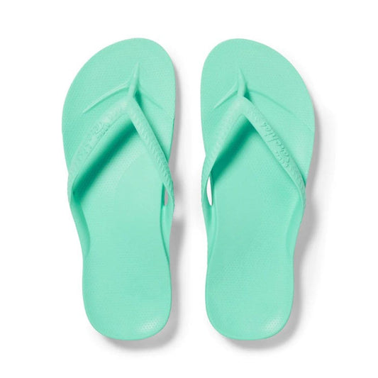 The Archies Footwear Arch Support Jandal Mint flip-flop in soft green has a comfy sole, roomy foot straps, and supportive arches.  ksnz