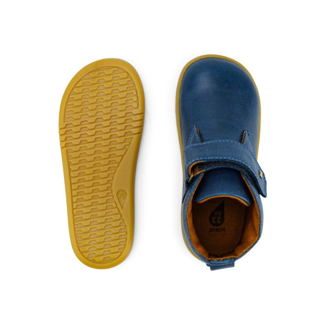 A pair of Bobux Iwalk IW Desert Boot Midnight Blue 625217 children’s shoes, shown with one displaying the wide strap closure from above and the other highlighting the yellow textured rubber sole from below., 9420068516984, 9420068516991, 9420068517004, 94
