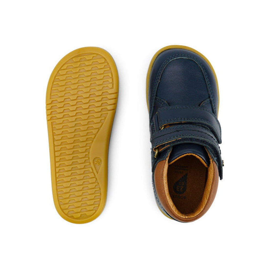 The Bobux Iwalk Timber Navy Leather Boot 632619 is a unisex children's shoe in navy blue leather with tan soles, shown from top and bottom views. Features include adjustable velcro straps and a comfortable tan interior lining., 9420068529298, 942006852930