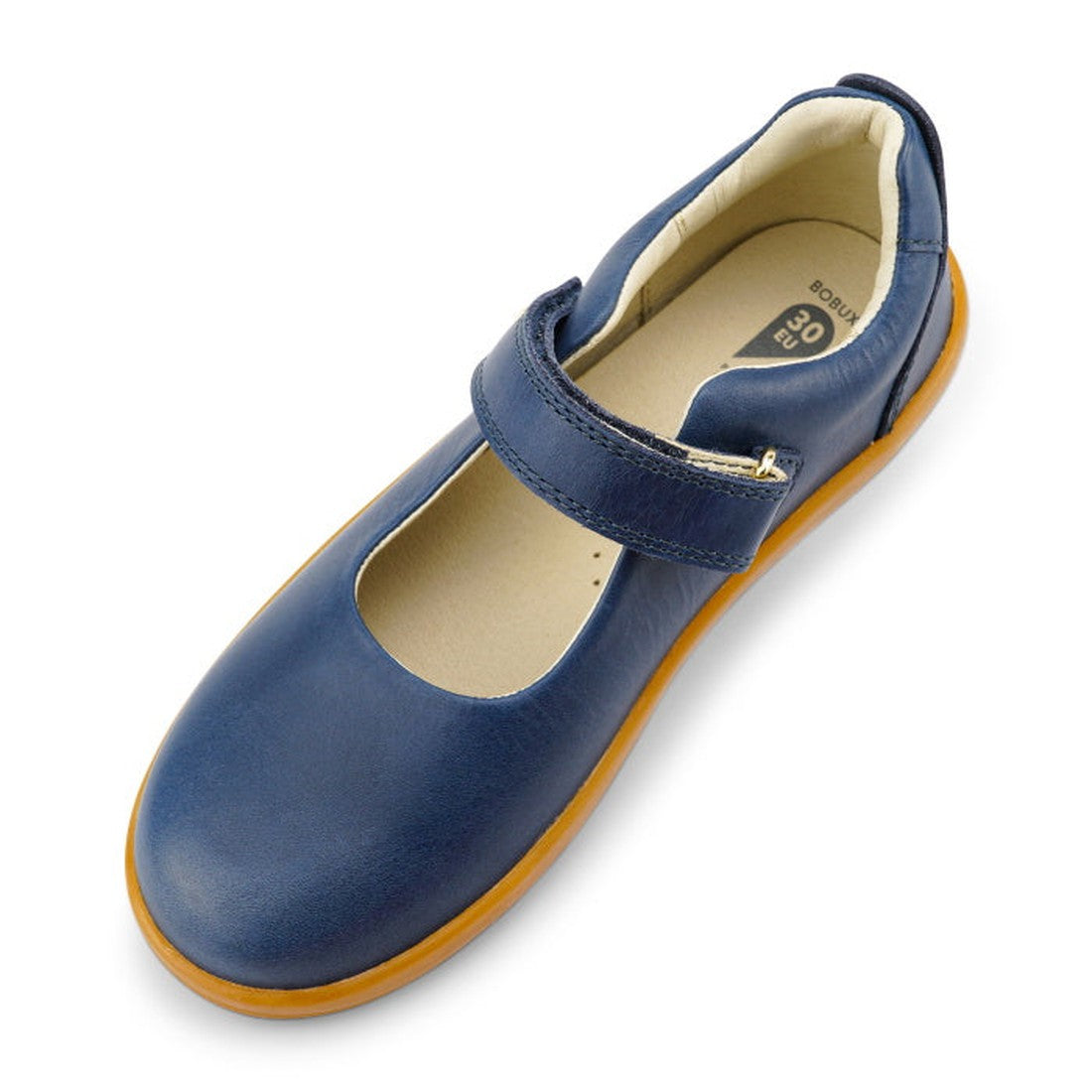 The Bobux Kid+ Delight Mary Jane Navy 831615Z features a single blue shoe with a brown sole and Velcro strap, shown from an angled top view. Its rounded toe and cushioned beige interior are ideal for girls' leather school shoes., 9420075721210, 9420075721