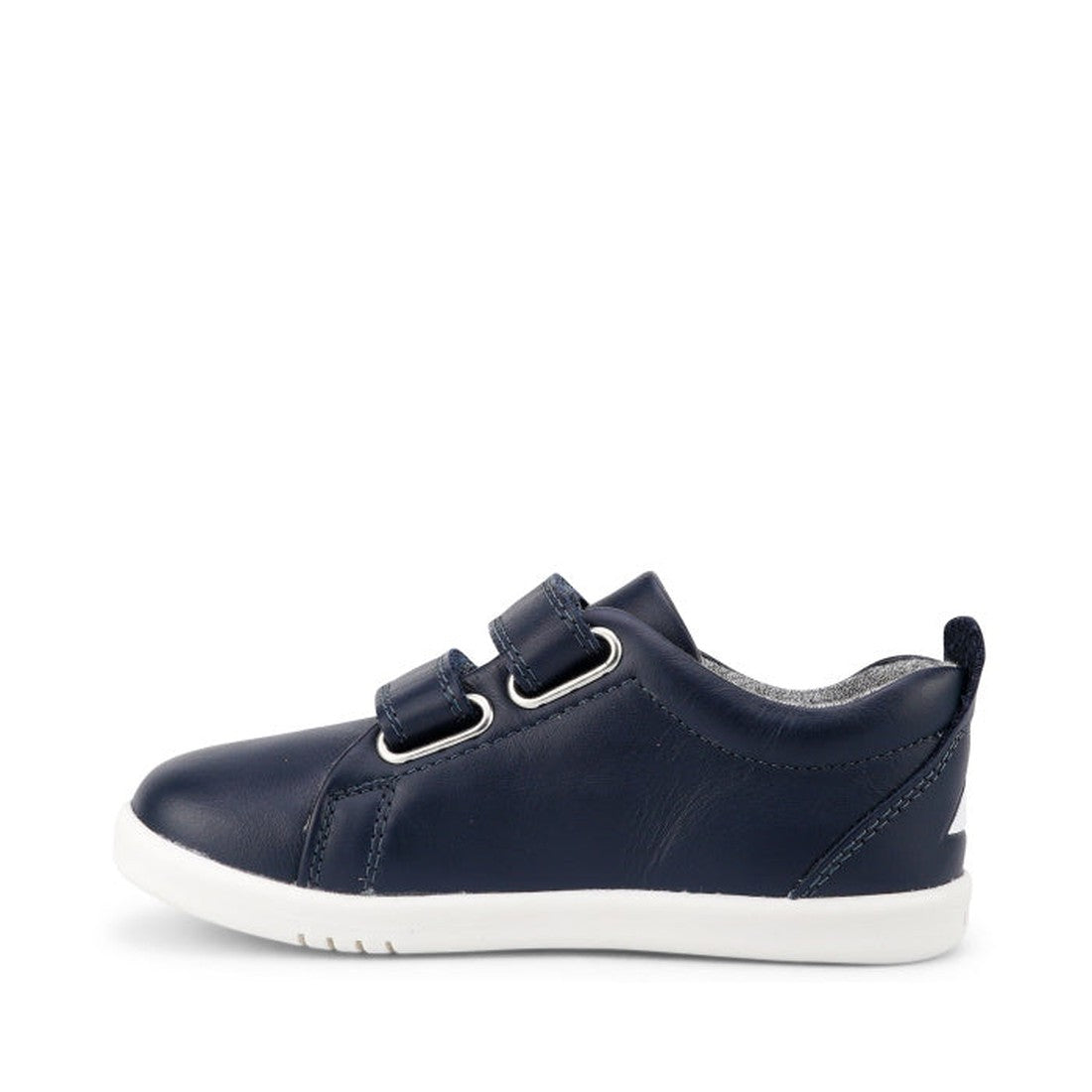 The Bobux Iwalk Grass Court Navy Leather Trainer 633723J is a kids' navy blue casual shoe featuring two velcro straps and a white rubber sole, displayed in side profile on a plain white background., 9420075792548, 9420075791404, 9420075792227, 94200757927