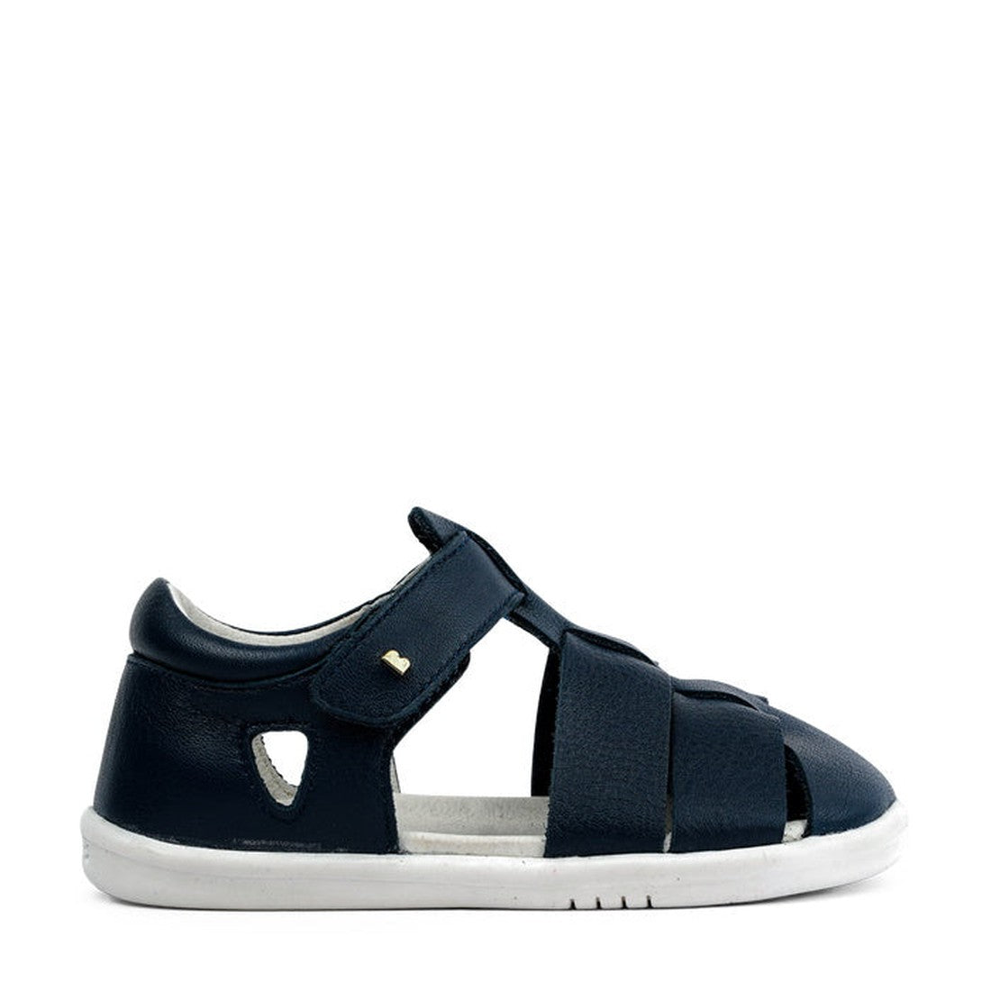 The Bobux IWalk Tidal Closed Toe Quick Dry Sandal Navy 634404A is a children's navy blue sandal with a closed toe and heel, adjustable Velcro strap, cut-out details, quick dry leather, and a white rubber sole, shown on a white background., 9420062048221, 