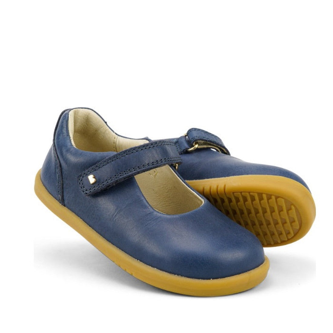 The Bobux Iwalk Delight Mary Jane Midnight Blue 628048 features a leather upper, velcro strap, and tan rubber soles, shown against a white background.