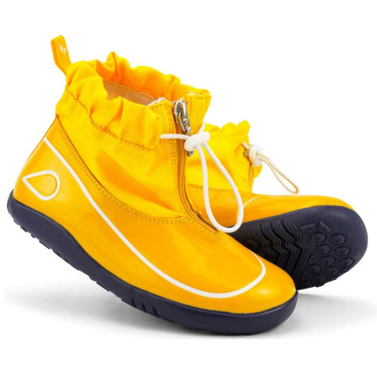 The Bobux Kid+ Splash Boot Waterproof Yellow 839001 features bright yellow waterproof design, black soles, white trim, a front zipper, lightweight build, and white drawstring closures—perfect shoes for kids.