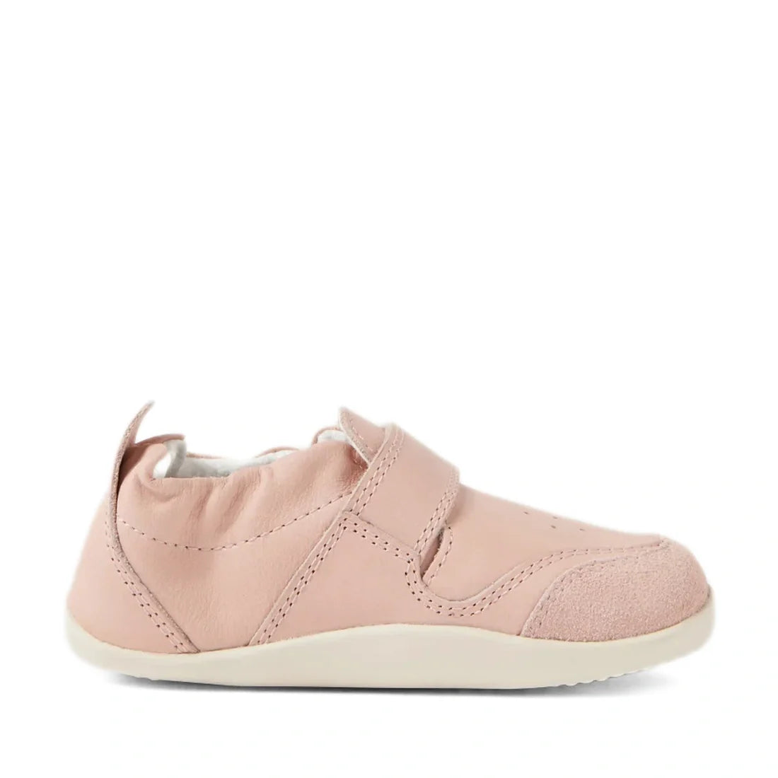 The Bobux XP Explorer Ripple First Walker Cameo Rose 502603 is a single soft pink baby shoe with a flexible white sole, velcro strap, and suede toe cap, photographed from the side on a white background—perfect as stylish first walker shoes for your little
