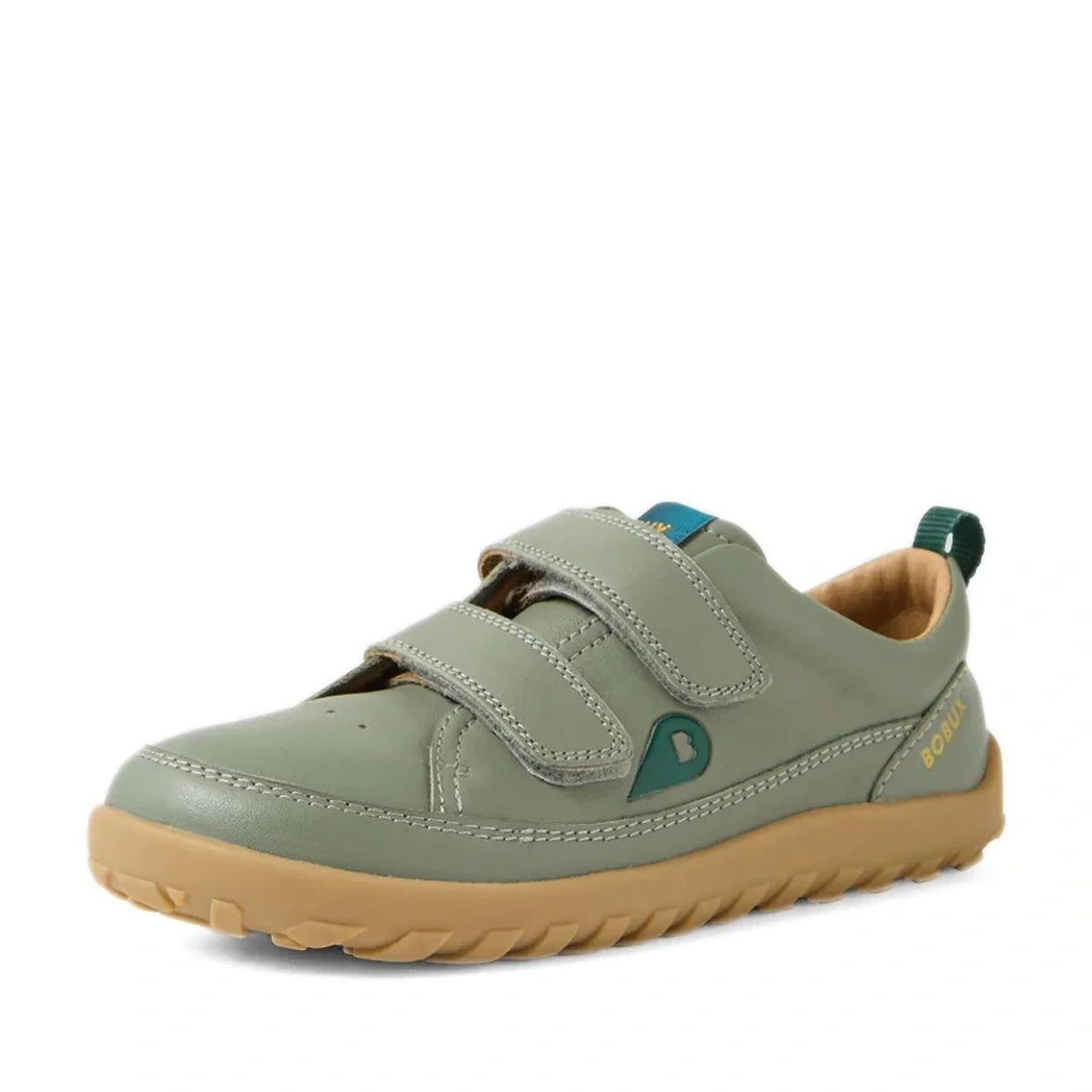Bobux KP Kids Plus Dawn Leather Sneaker in Vetiver Green, a light green children’s barefoot sneaker featuring a wide toe box, two Velcro straps, teal accents, and a light brown zero-drop sole, shown at an angle on a white background.