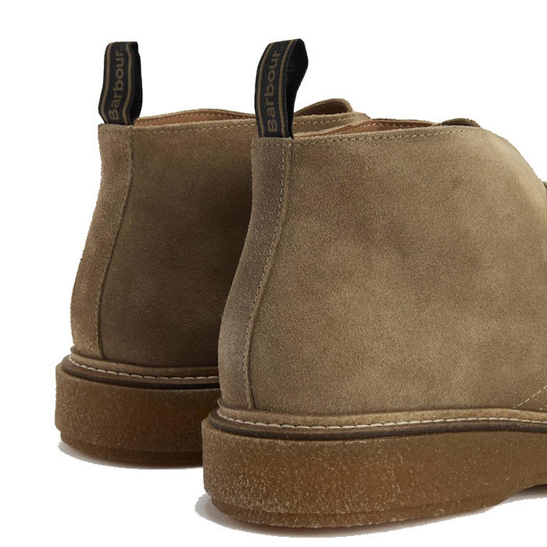 A close-up of the back of two Barbour Mens Blaine Chukka Lace Up Taupe Suede Boots with gum soles and black fabric pull tabs featuring the Barbour label., 5063669166789, 5063669166796, 5063669166734, 5063669166741