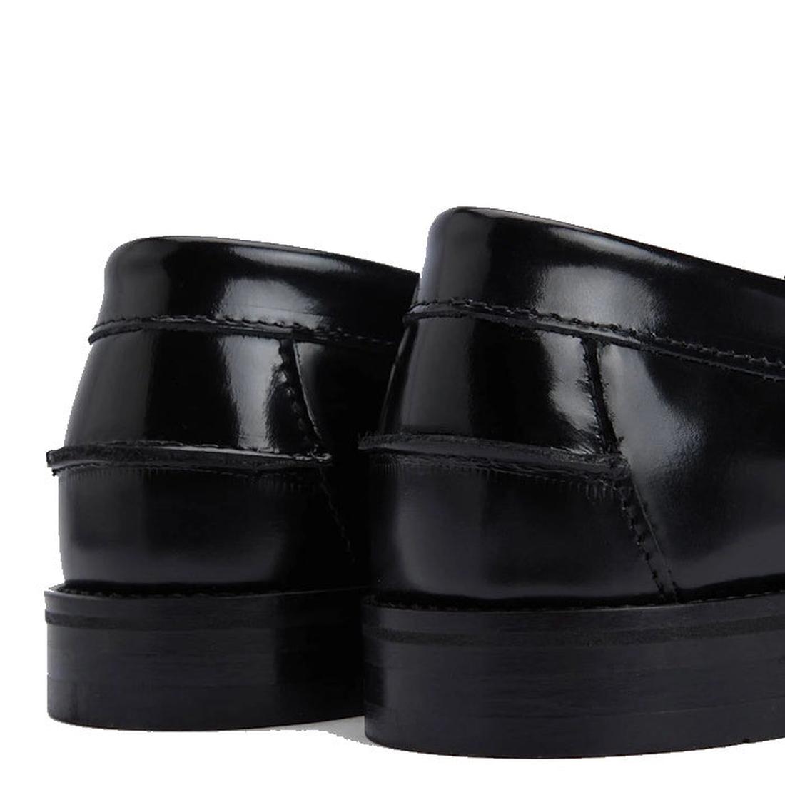 Close-up of the heels of Barbour Jen Black Womens Croc Tassel Leather Loafers, highlighting the glossy croc-embossed premium leather and detailed stitching against a white background., 5020985982790, 5020985983353, 5020985983933, 5020985984381, 5020985984