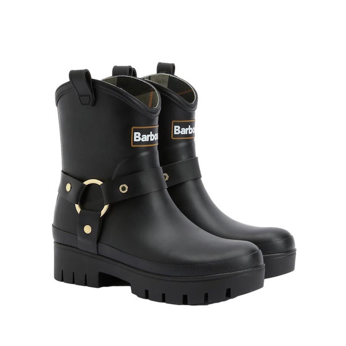 The Barbour Elley Harness Black Wellington Womens Rainboot features chunky soles, gold hardware, a front Barbour logo, and decorative ankle straps with buckles in durable black rubber.