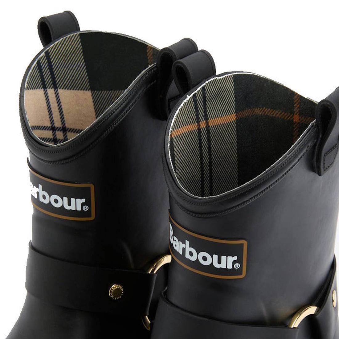 A close-up of two Barbour Elley Harness Black Wellington Womens Rainboots with tartan linings, front Barbour logos, pull loops, and metal side buckles, highlighting their classic harness style., 5020985983018, 5020985983575, 5020985984107, 5020985984558, 