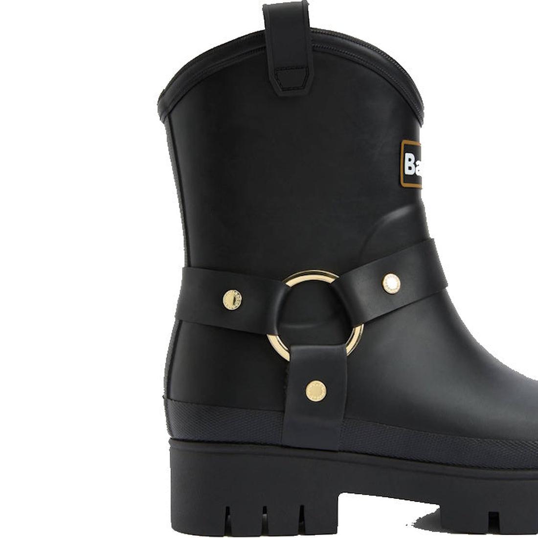 The Barbour Elley Harness Black Wellington Women's Rainboot is a black rubber ankle boot with a thick treaded sole, decorative strap, gold ring and studs—stylish, rain-ready footwear inspired by classic harness Wellington boots., 5020985983018, 5020985983